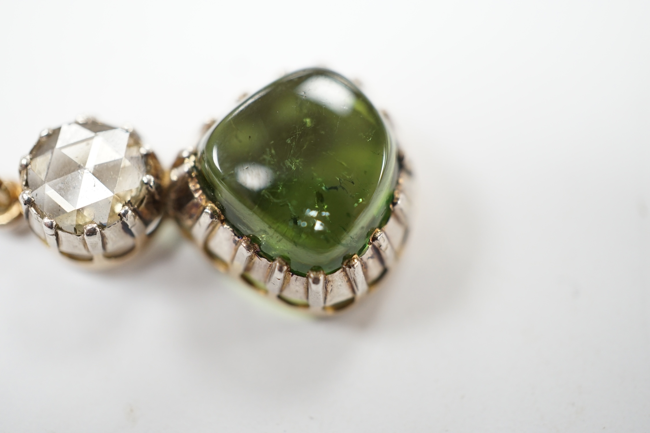 A Georgian yellow and white metal, rose cut diamond and shaped cabochon green tourmaline set pendant, 24mm, on a yellow metal chain, 48cm, gross weight 5.8 grams. Fair condition.